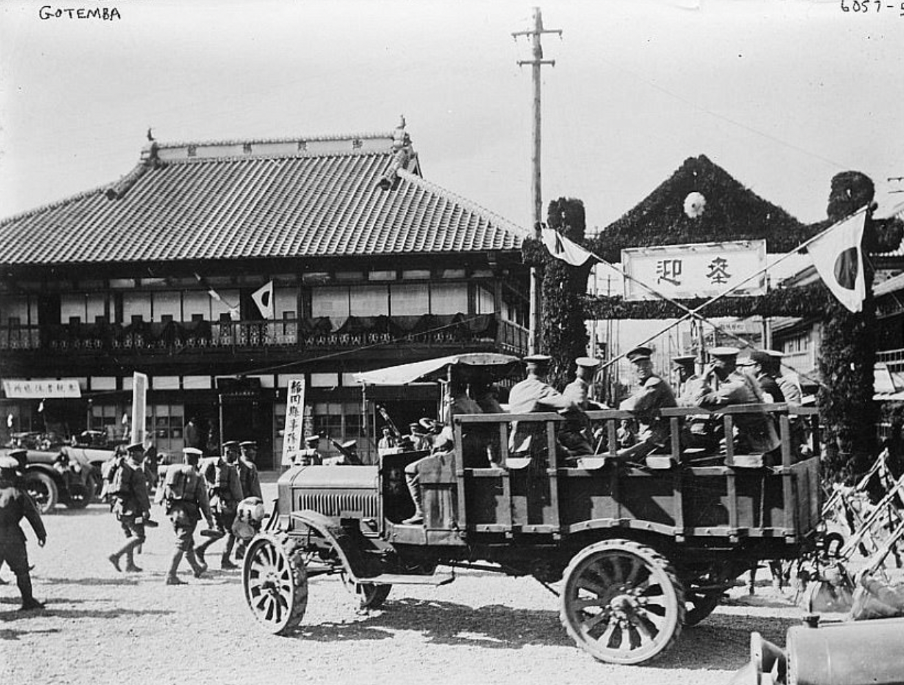 Several men ride in a vehicle, date unknown. 